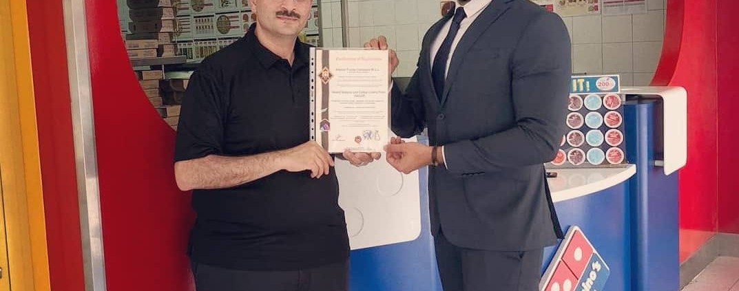 Domino’s Pizza country manager Mr. Salah Shawky (left) received the HACCP certificate from H.A. Consultancies business development associate Mr. Ammar Jameel