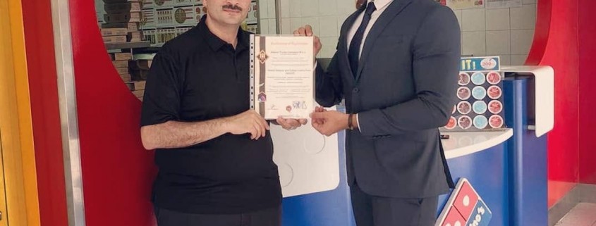 Domino’s Pizza country manager Mr. Salah Shawky (left) received the HACCP certificate from H.A. Consultancies business development associate Mr. Ammar Jameel